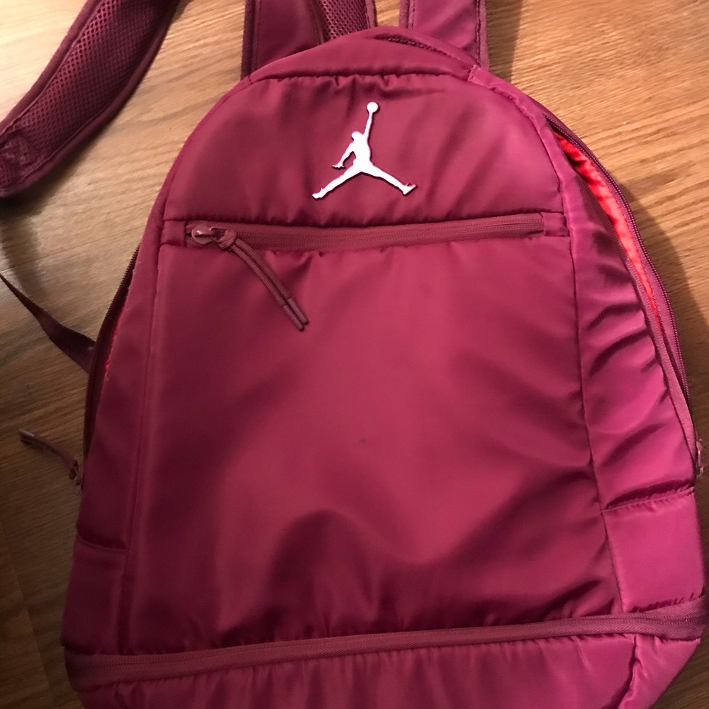 Maroon Jordan backpack.